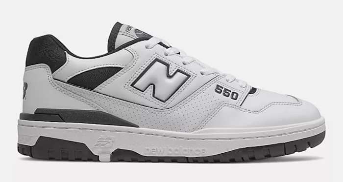 Side view of white and black New Balance shoe.